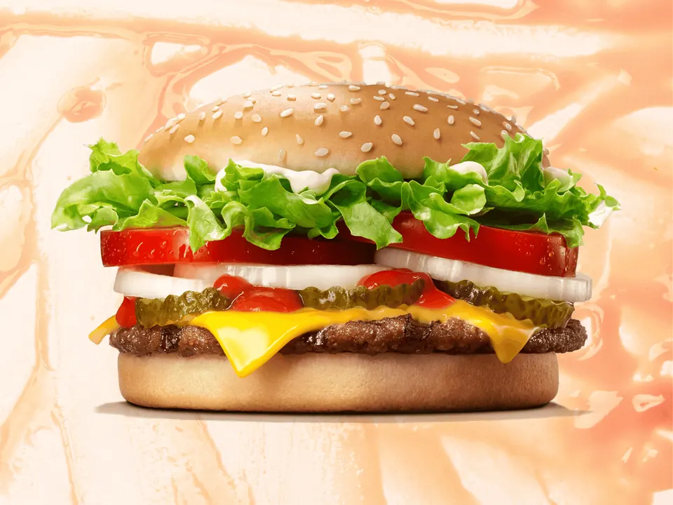 Cheeseburger with lettuce, tomato, onions and pickles