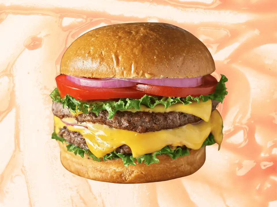 Double cheeseburger with lettuce, tomato and onions