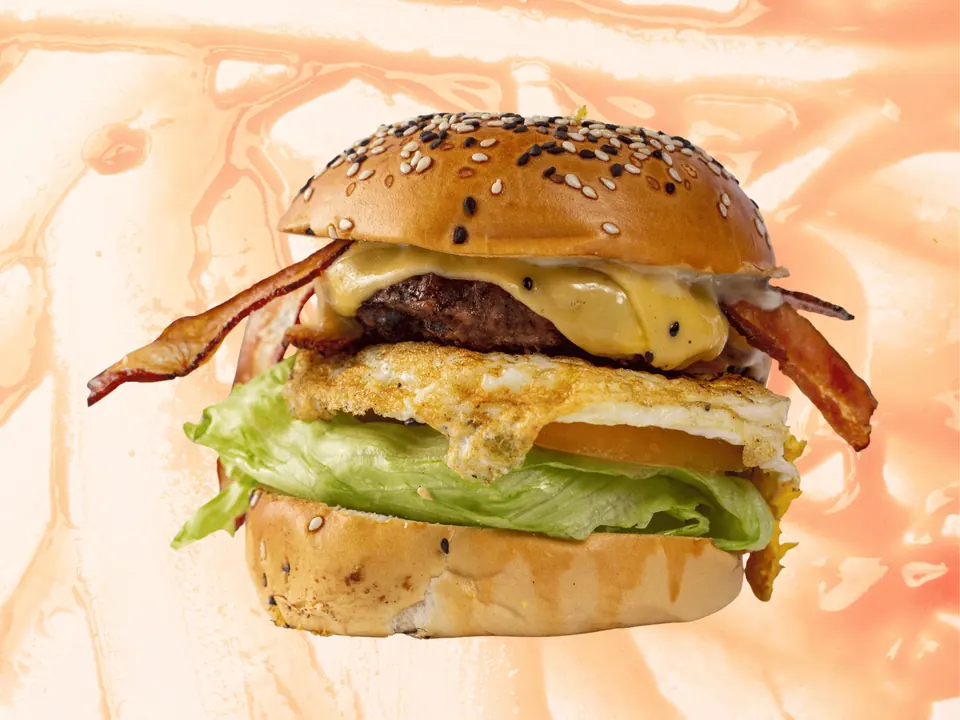 Cheeseburger topped with a fried egg