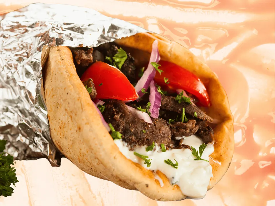 Gyro with lettuce, tomatoes, onions and tzatziki sauce